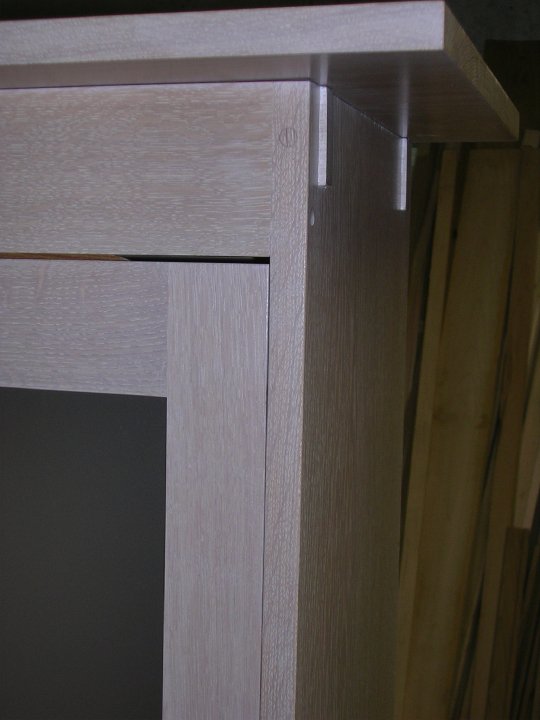 Details of mortis and tenon white oak linen cabinet with sliding doors by Nolan Wallenfang Custom Woodwork, Green Lake Wisconsin WI